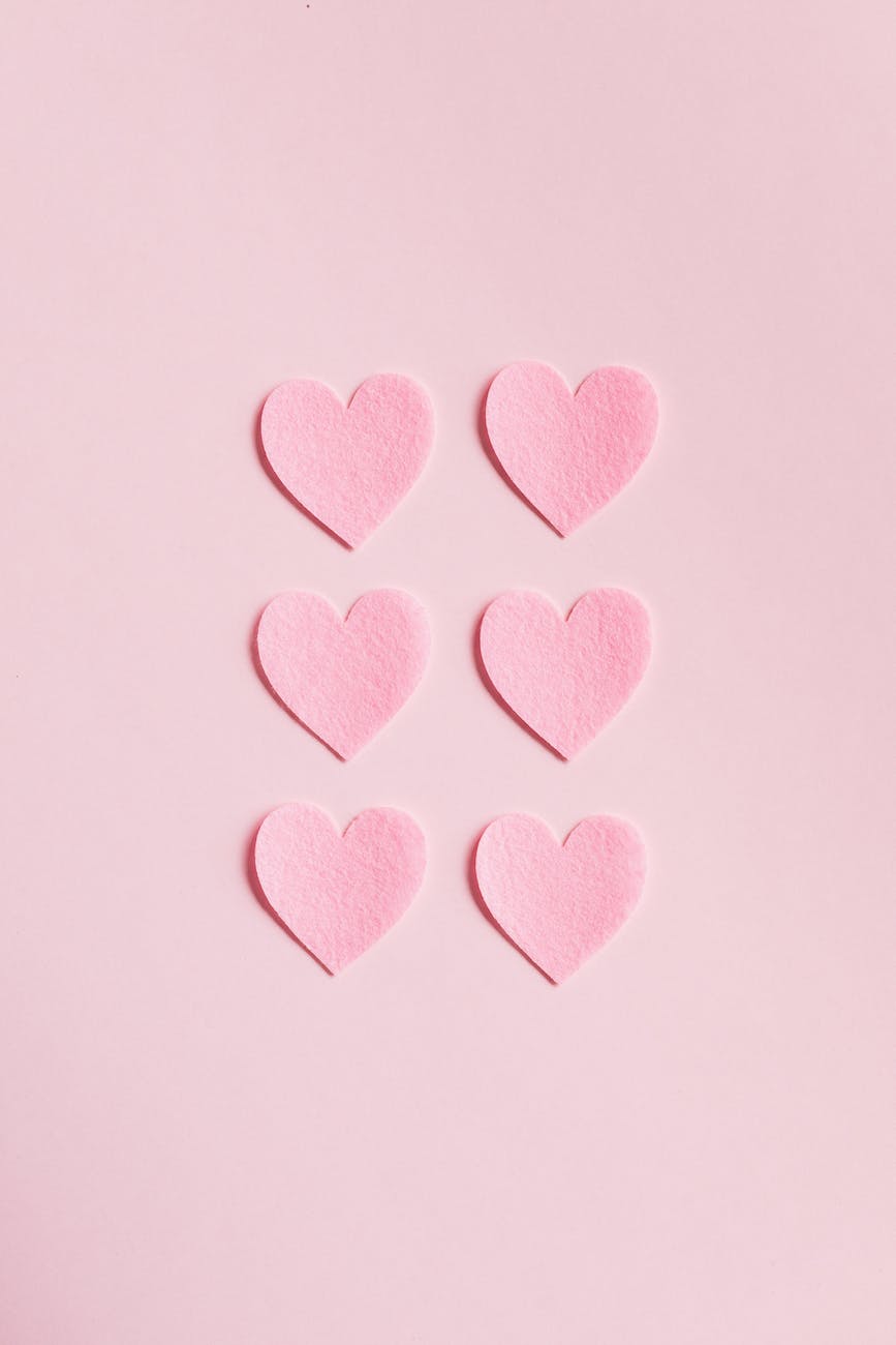 heart shaped cutouts on pink background