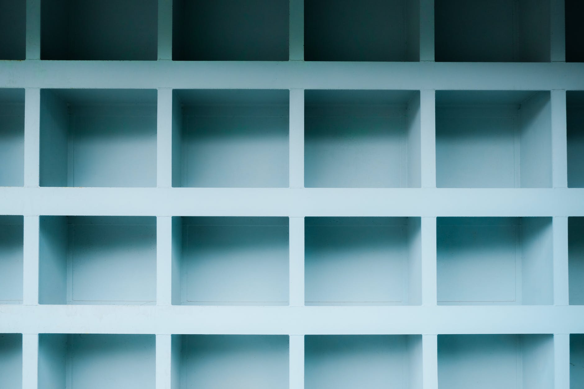 blue shelves with white squares in them